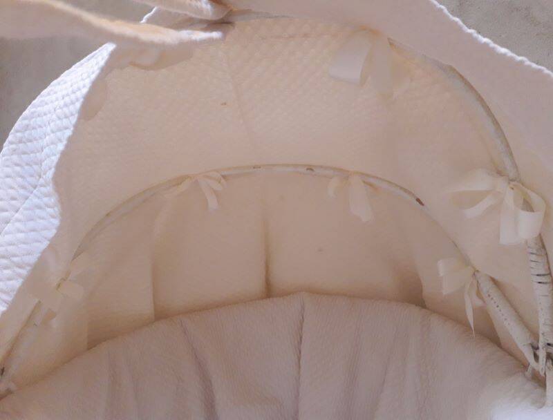 Wicker and painted wood baby cradle