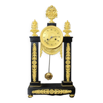 Period portico clock Restoration in black marble and gilded bronze early XIX