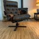 Vintage leather armchair with wooden armrests