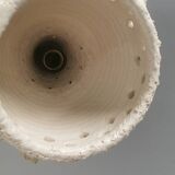 Ceramic hanging lamp in creamy white color that almost looks like a corral