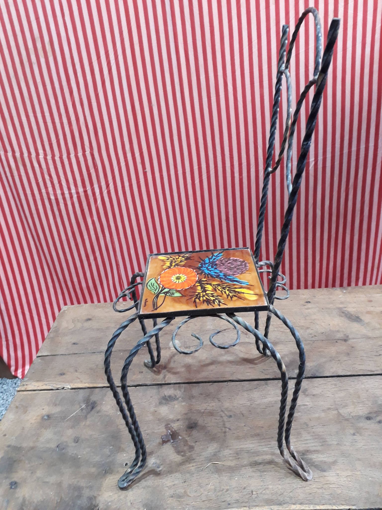 Wrought iron chair with enamelled plate signed Vallauris