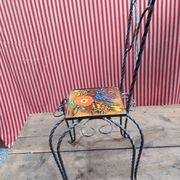 Wrought iron chair with enamelled plate signed Vallauris