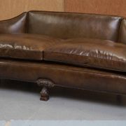 Restored Regency canapé in leather with sculpted Hermès frame.