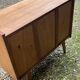 Rattan chest of drawers with tapered legs