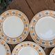 10 dessert plates Saint Amand Amandinoise frilled with orange and black flowers.