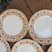 10 dessert plates Saint Amand Amandinoise frilled with orange and black flowers.