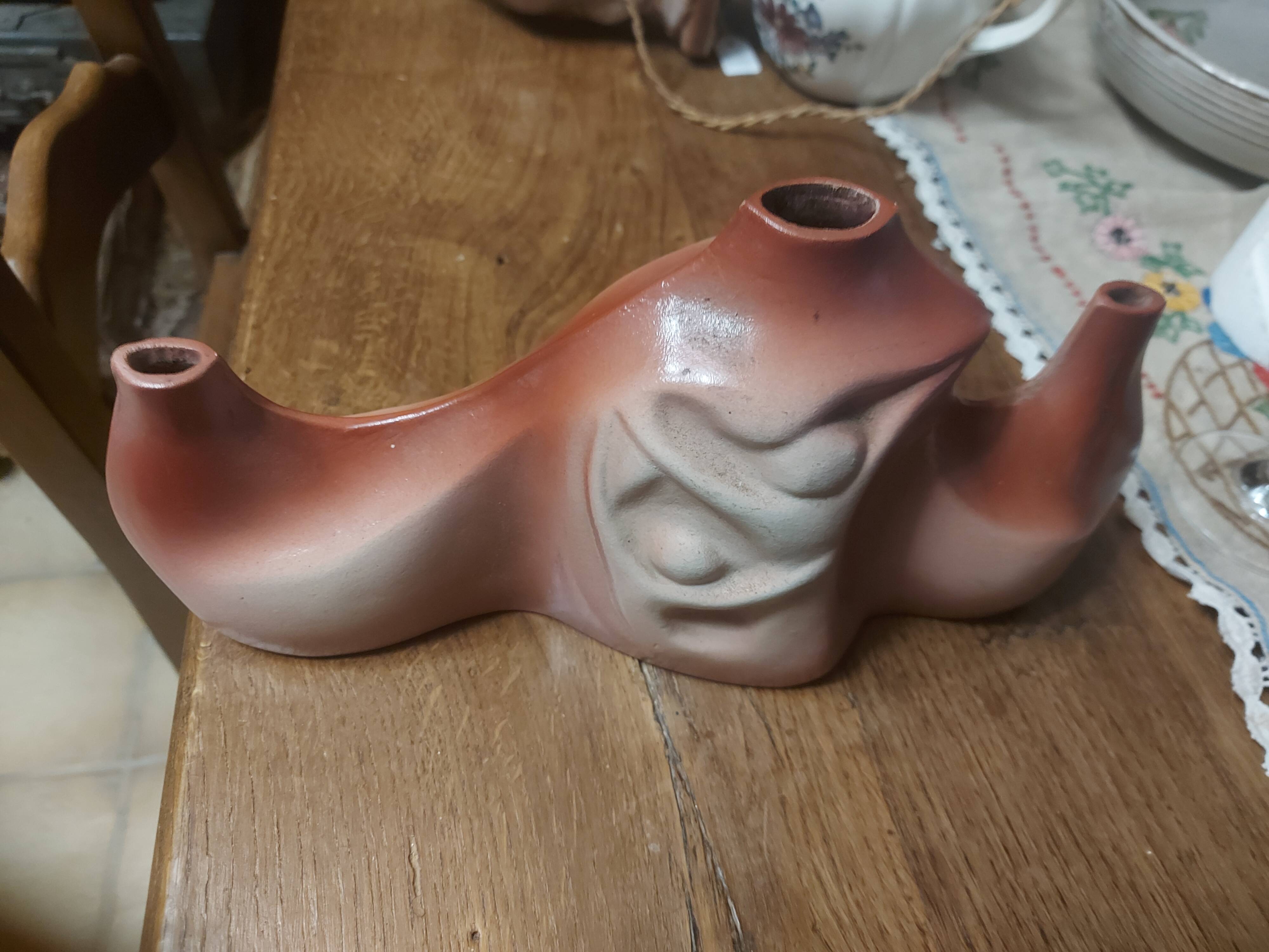 Decorative ceramic vase with organic shapes in Art Nouveau style.