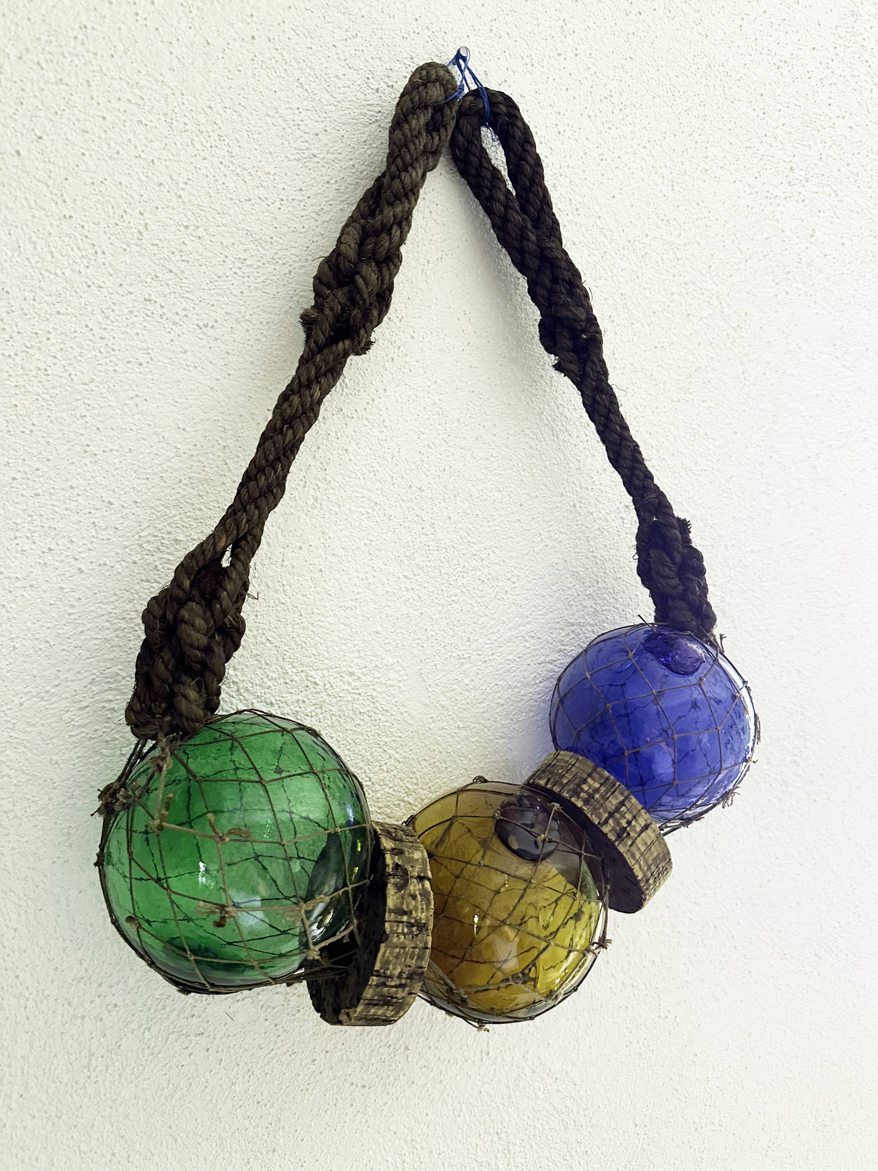 Fishing floats made of blown glass, cork, and rope. France, 1960s.