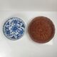 Set of 6 ceramic presentation plates in white and blue, floral pattern with woven wicker frame, 1970s/80s.