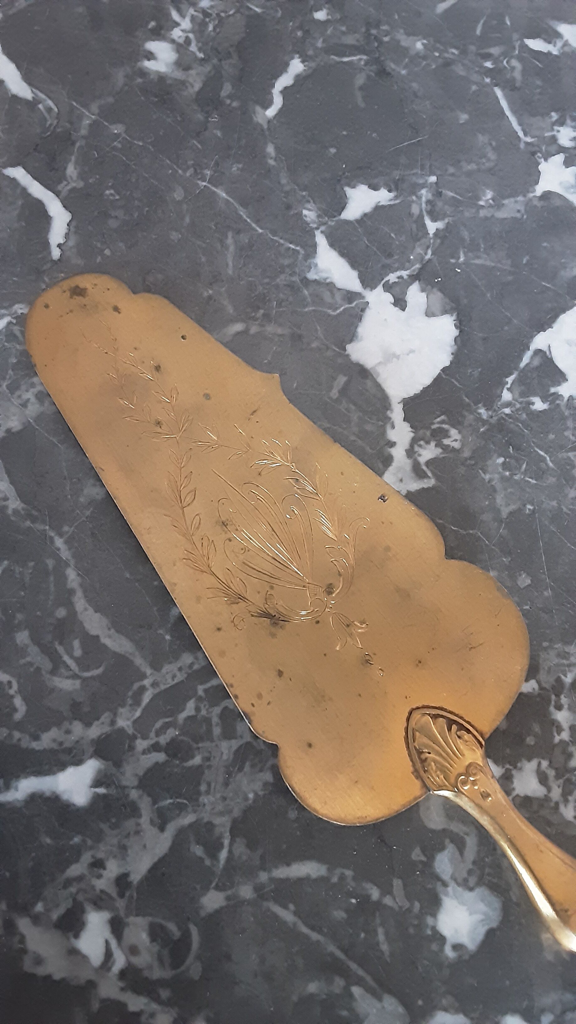 Old brass and silver pie shovel