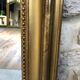 Old fireplace mirror 144cm/97.5cm, pearled, late 19th century, gilded with pricked ice leaf.