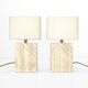 Pair of solid travertine table lamps with incised decoration, French production.