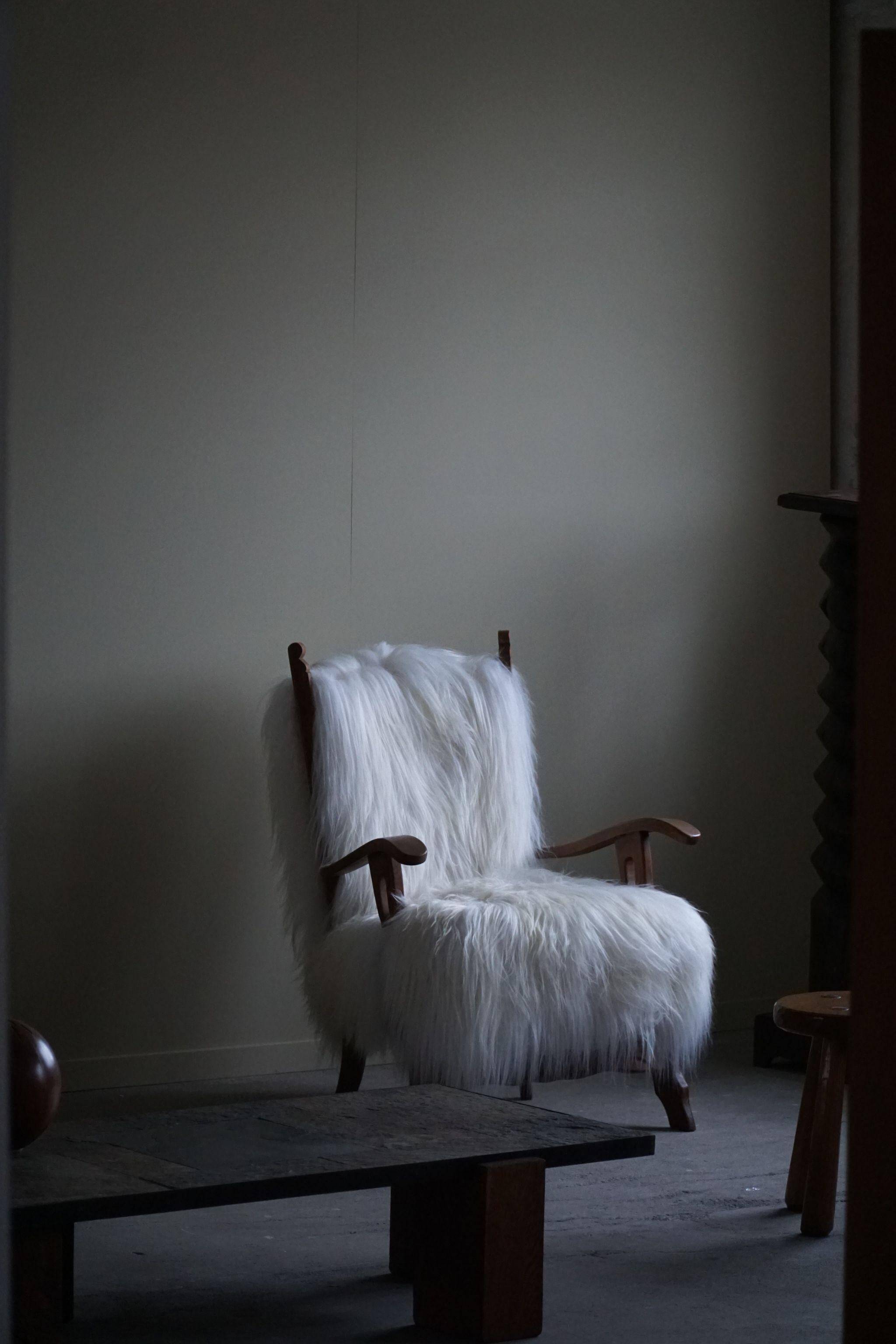 Henning Kjærnulf, armchair reupholstered in long-haired Icelandic sheepskin, 1950