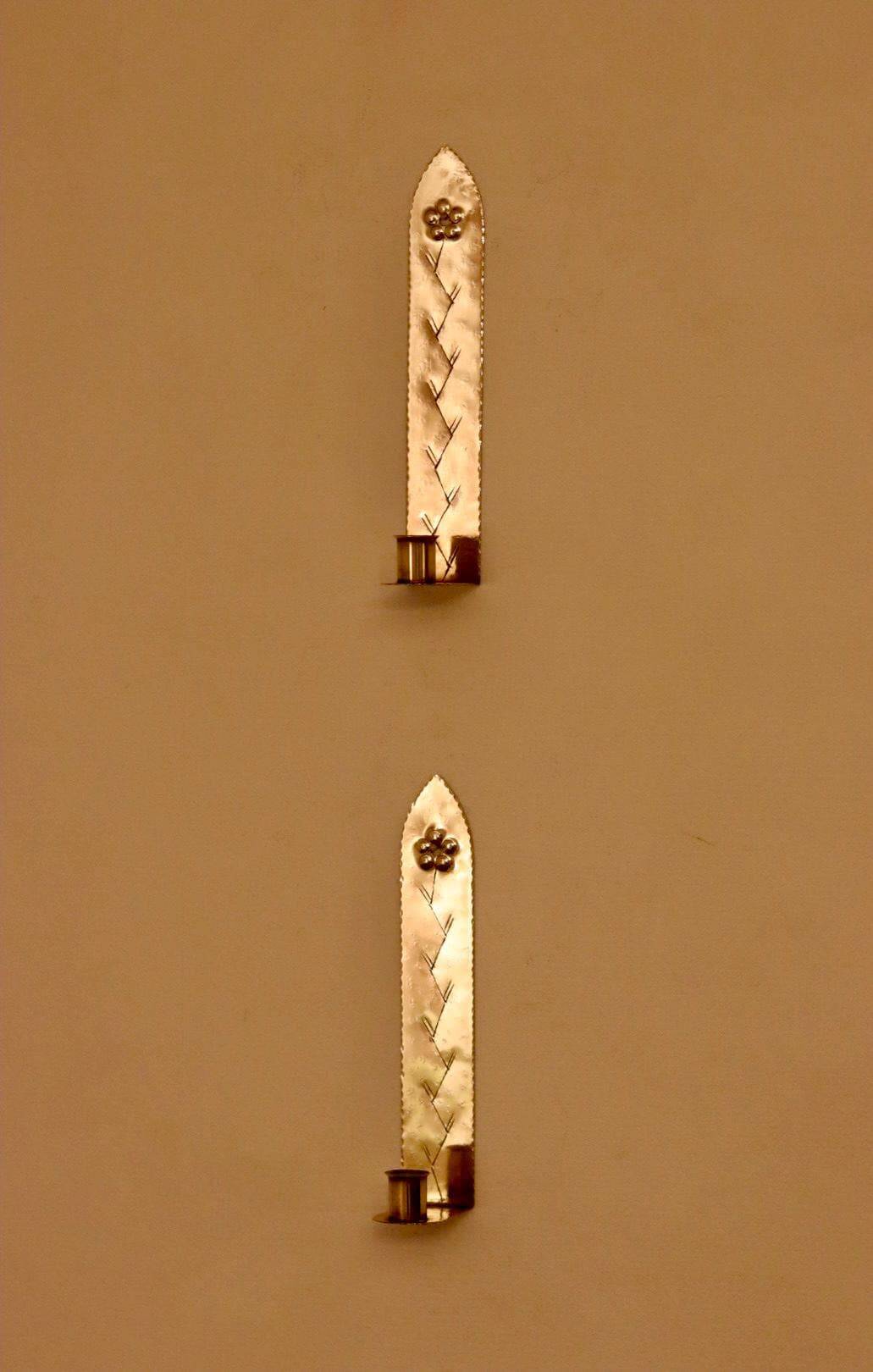 A pair of Swedish brass wall sconces from the mid-century.