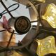Older hanging lamp, made of metal with yellow prisms.