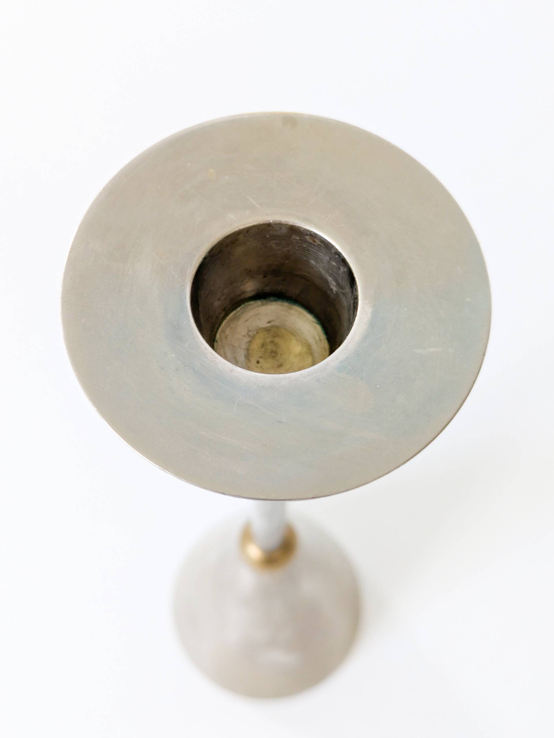 Pair of postmodern candlesticks in Memphis style made of steel and brass.