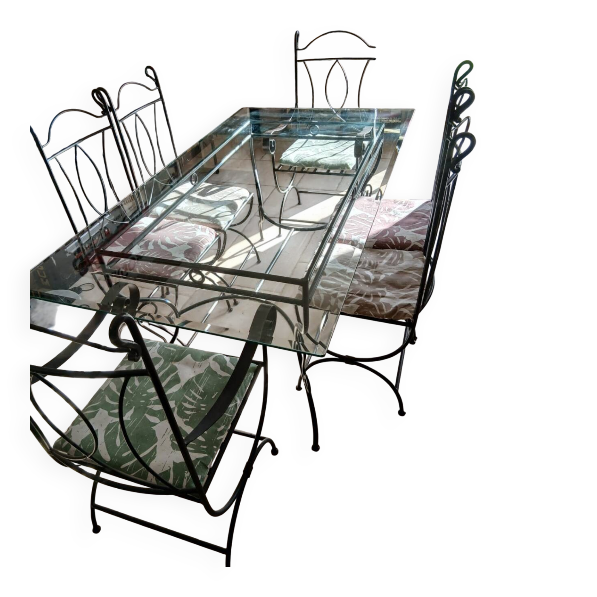 Glass table and wrought iron chairs