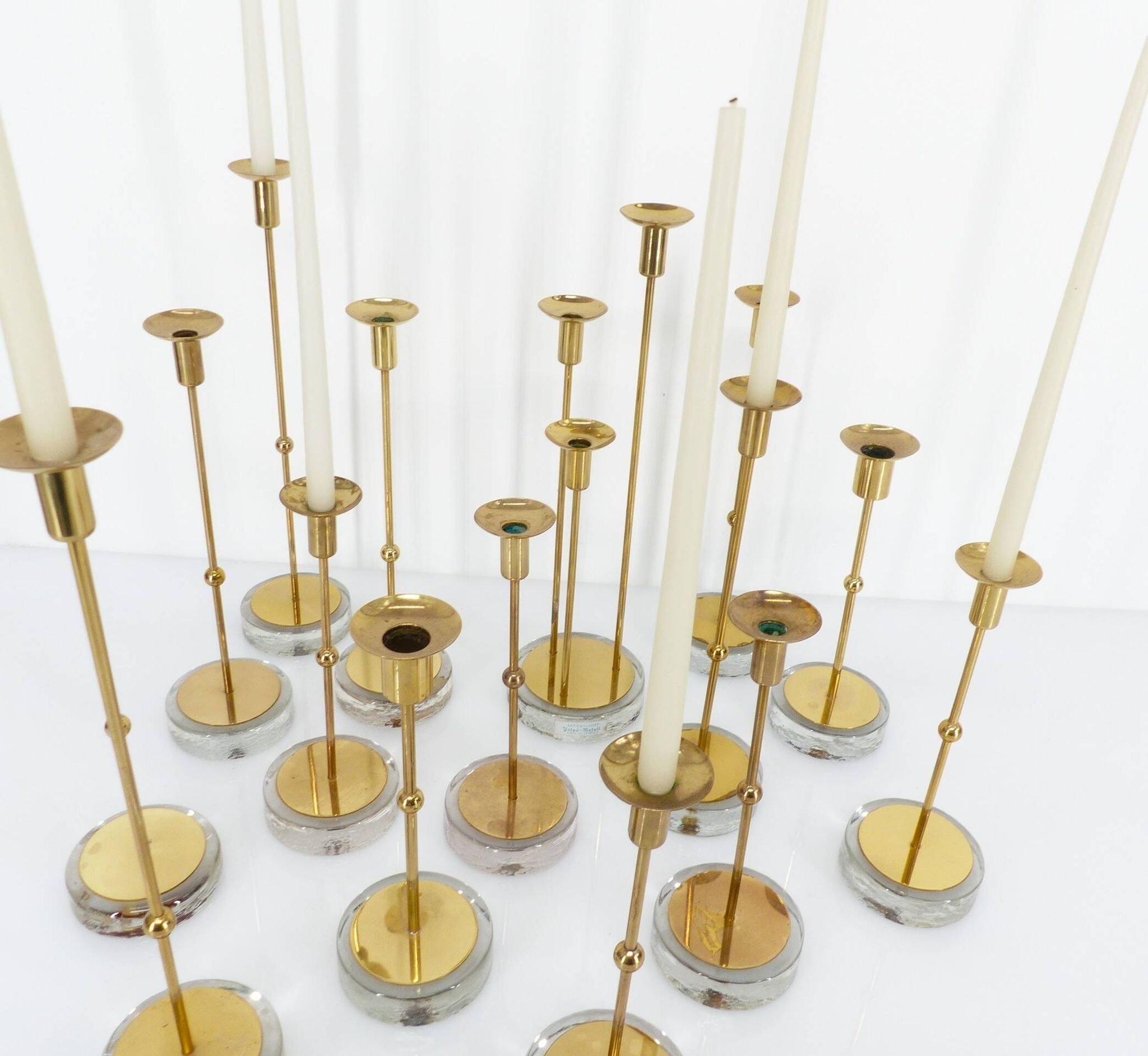 Set of 15 Scandinavian candle holders in brass and glass, Gunnar Ander, Ystad Met