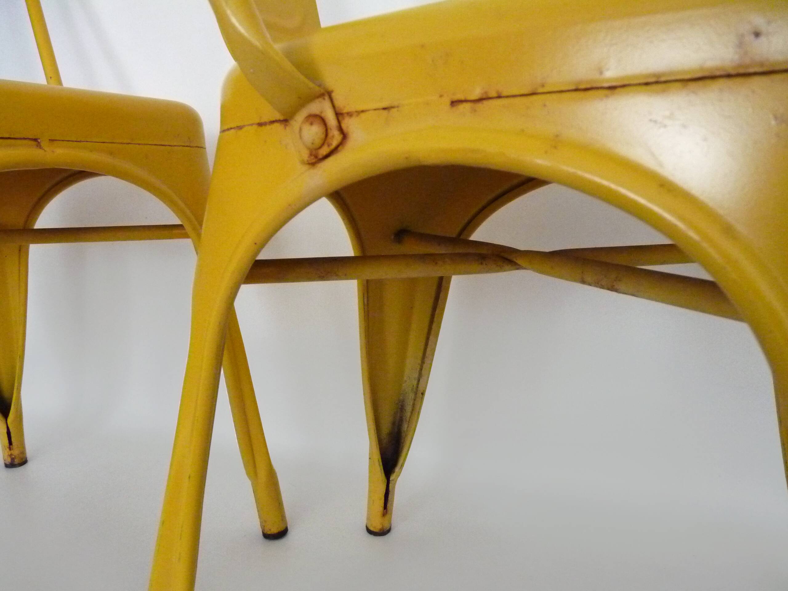 Pair of Tolix Chairs in yellow metal by Xavier Pauchard