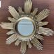 Vintage sun mirror in golden resin 60s/70s