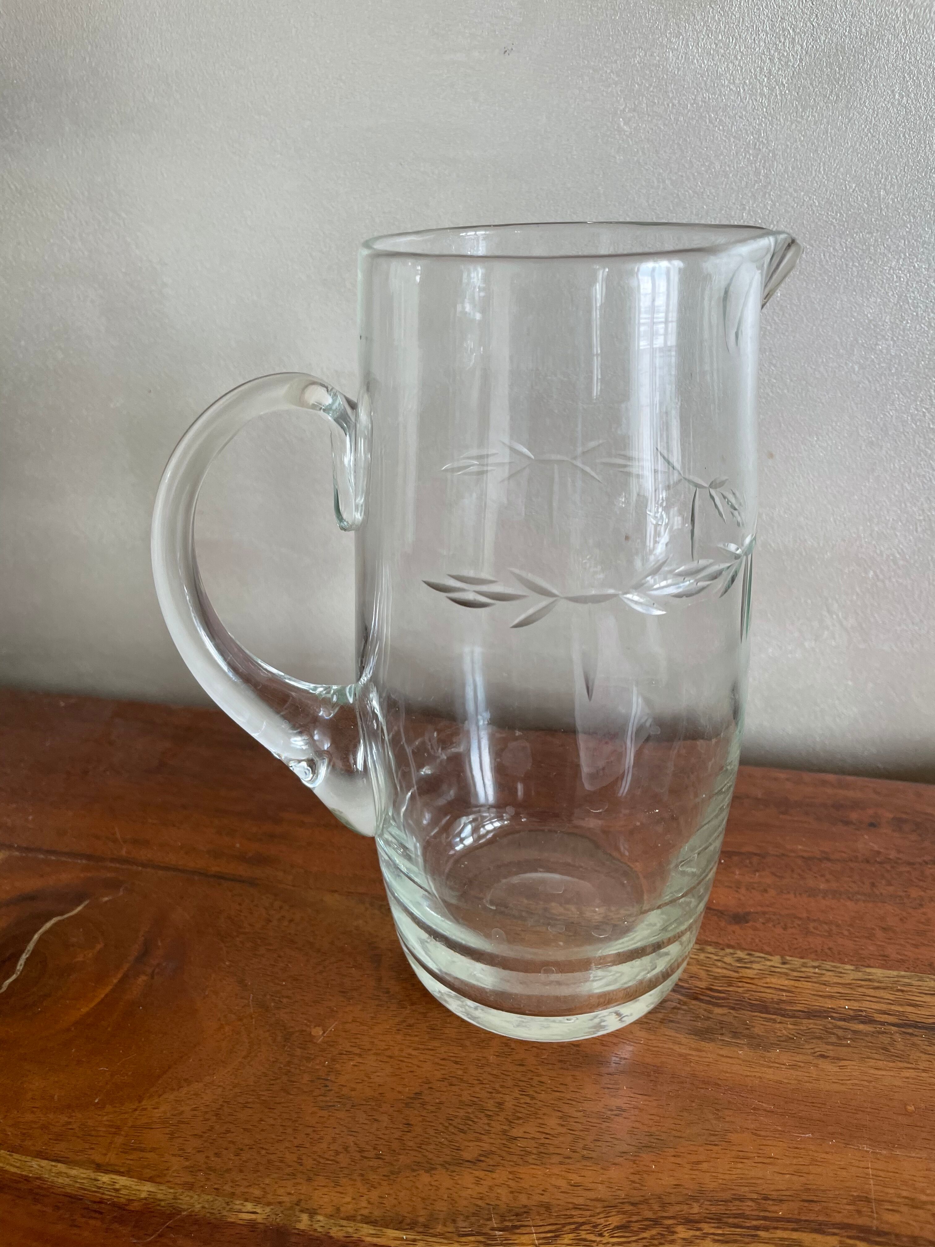 Engraved glass pitcher