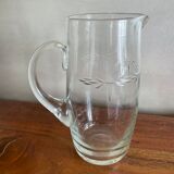 Engraved glass pitcher