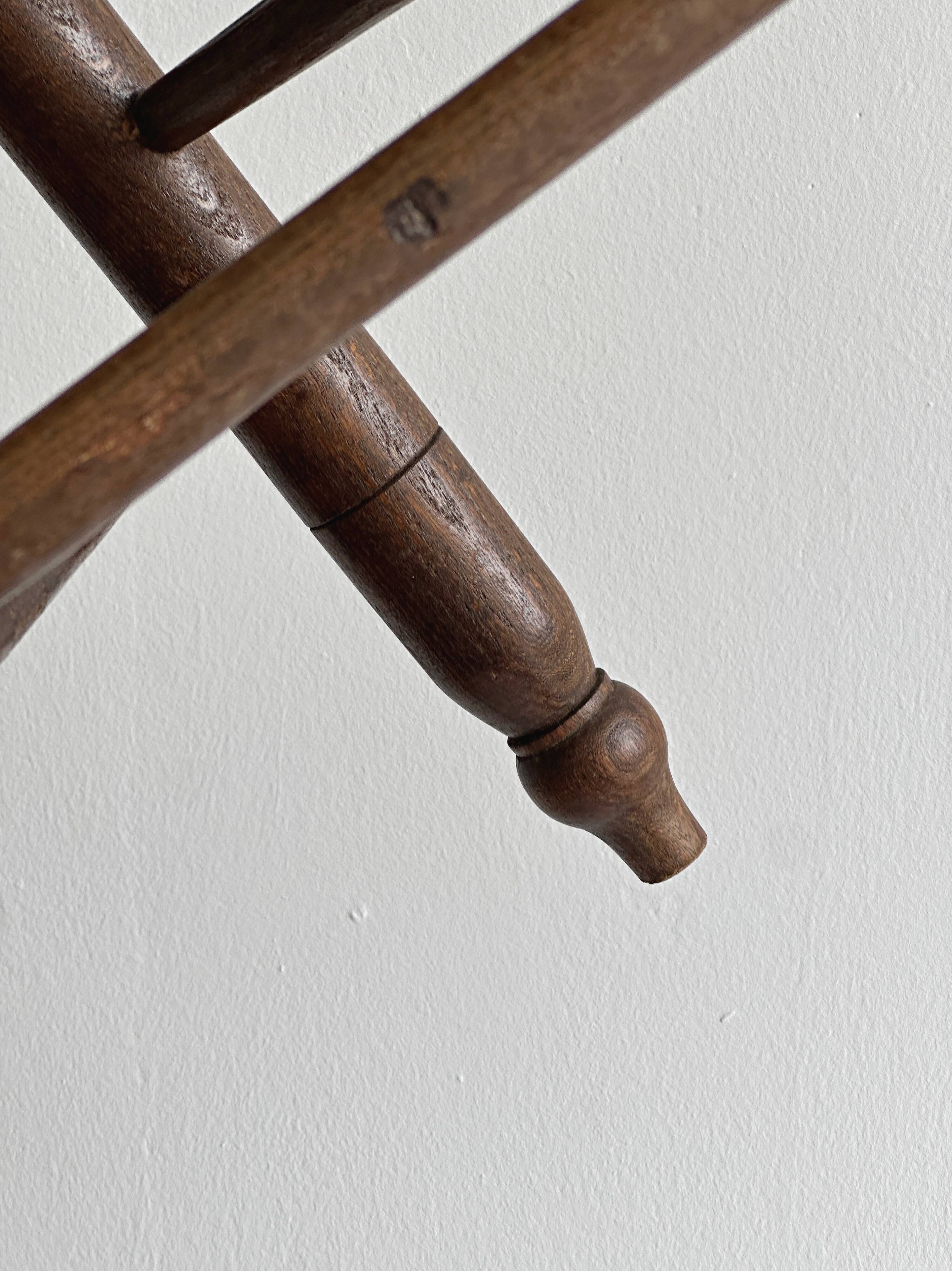 Triangular turned wooden stool