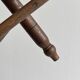 Triangular turned wooden stool