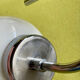 Pair of chrome metal wall lights with white glass globe.