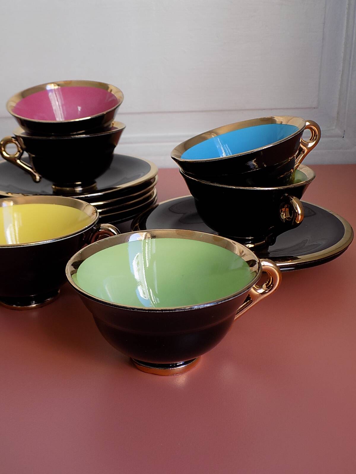 set of 9 black and gold Salins cups and saucers