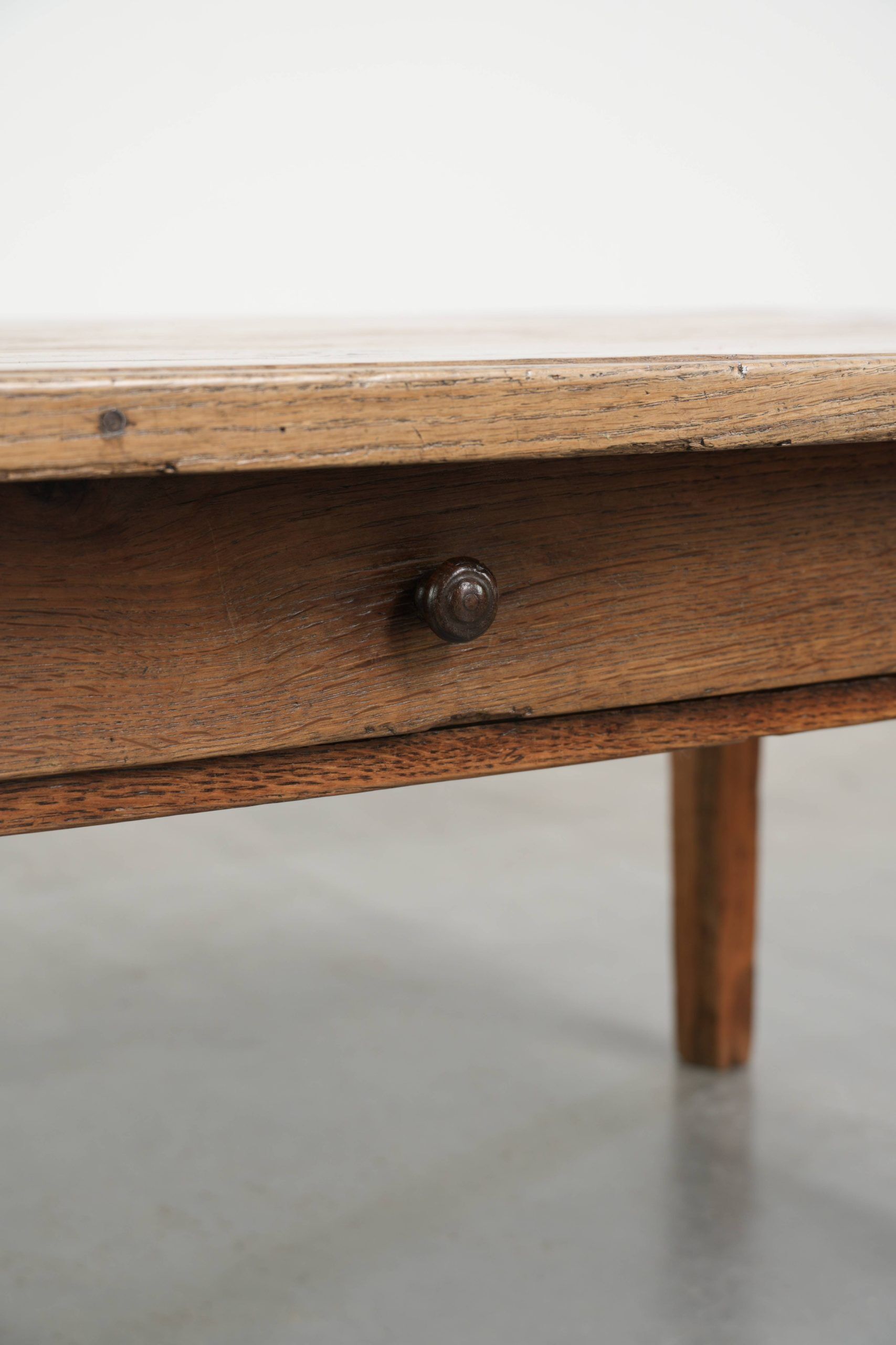 Antique pinewood coffee table with a drawer and a rural appearance