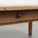 Antique pinewood coffee table with a drawer and a rural appearance