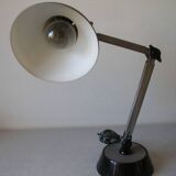Super Chrome old articulated metal desk lamp on workshop decor base
