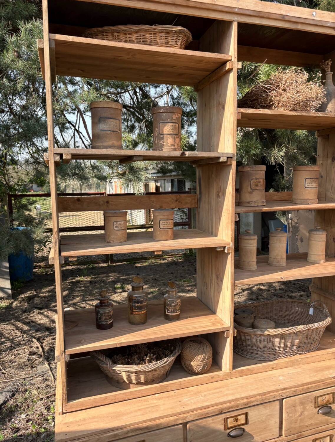 Large antique workshop furniture with drawers and shelves.