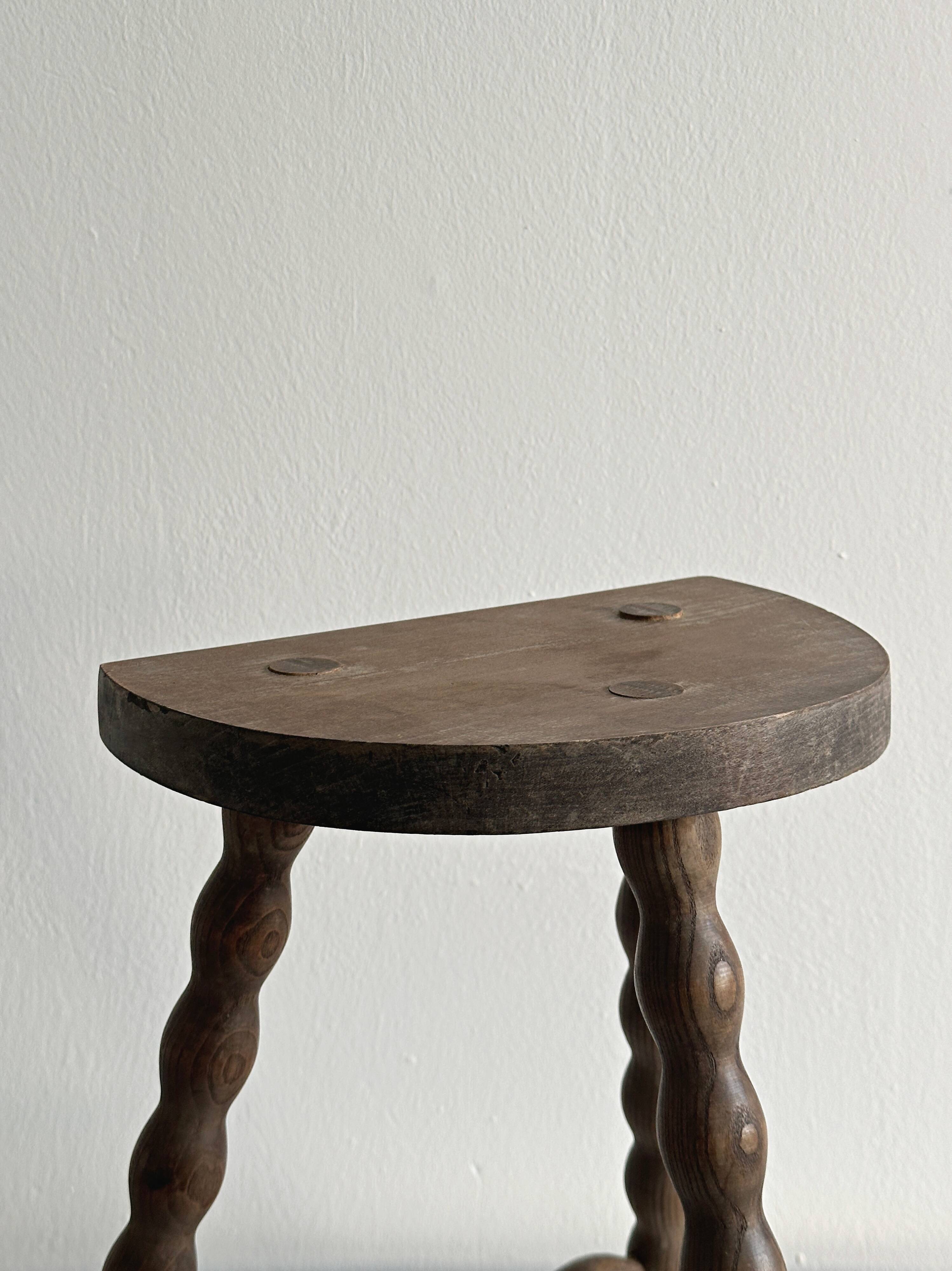 Tripod stool with turned wooden legs