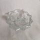 Low candle holder in chiseled glass