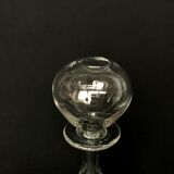 Glass oil lamp blows on foot shower