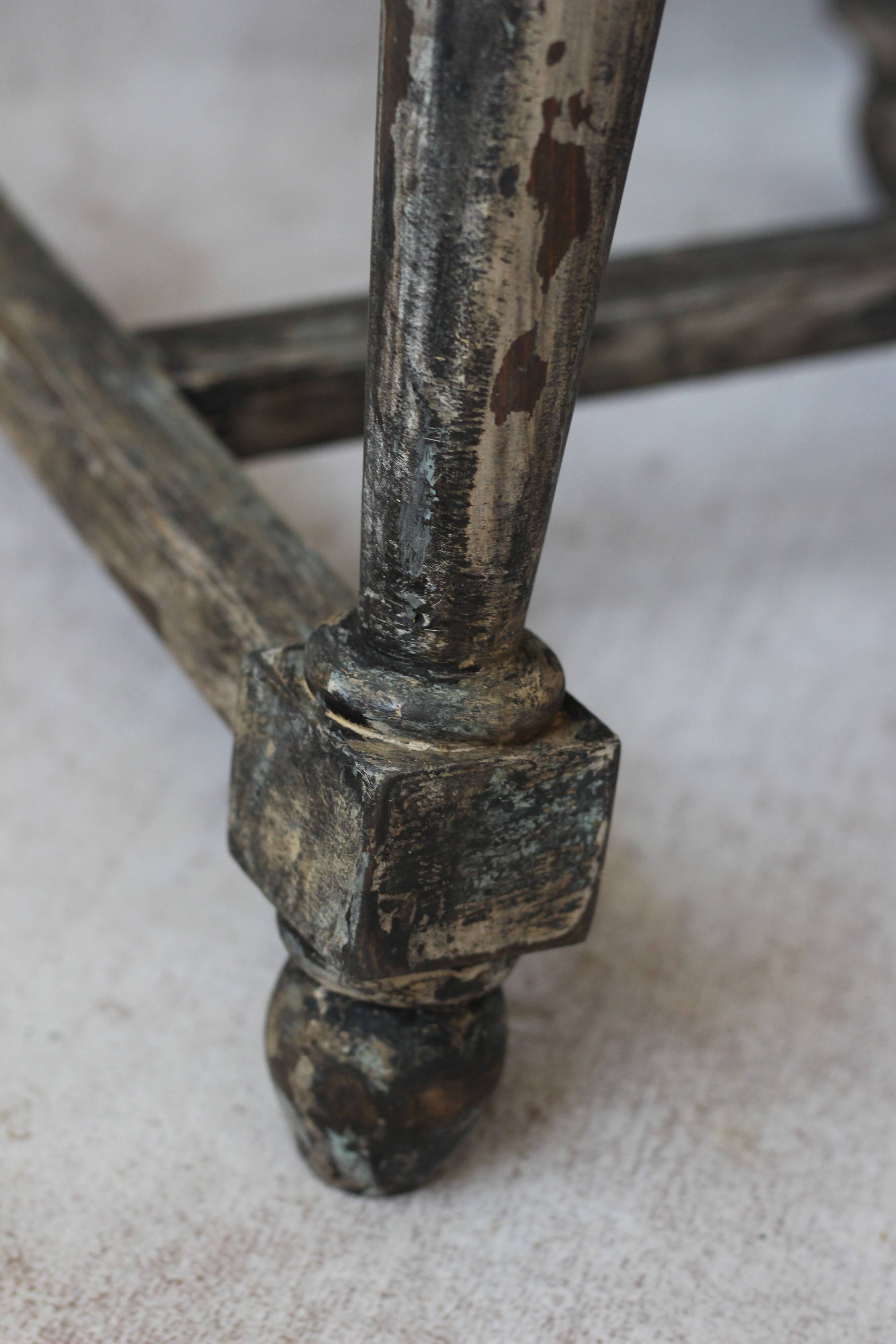 Patinated wooden stool with straw seat
