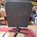Scandinavian tilting and rotating armchair