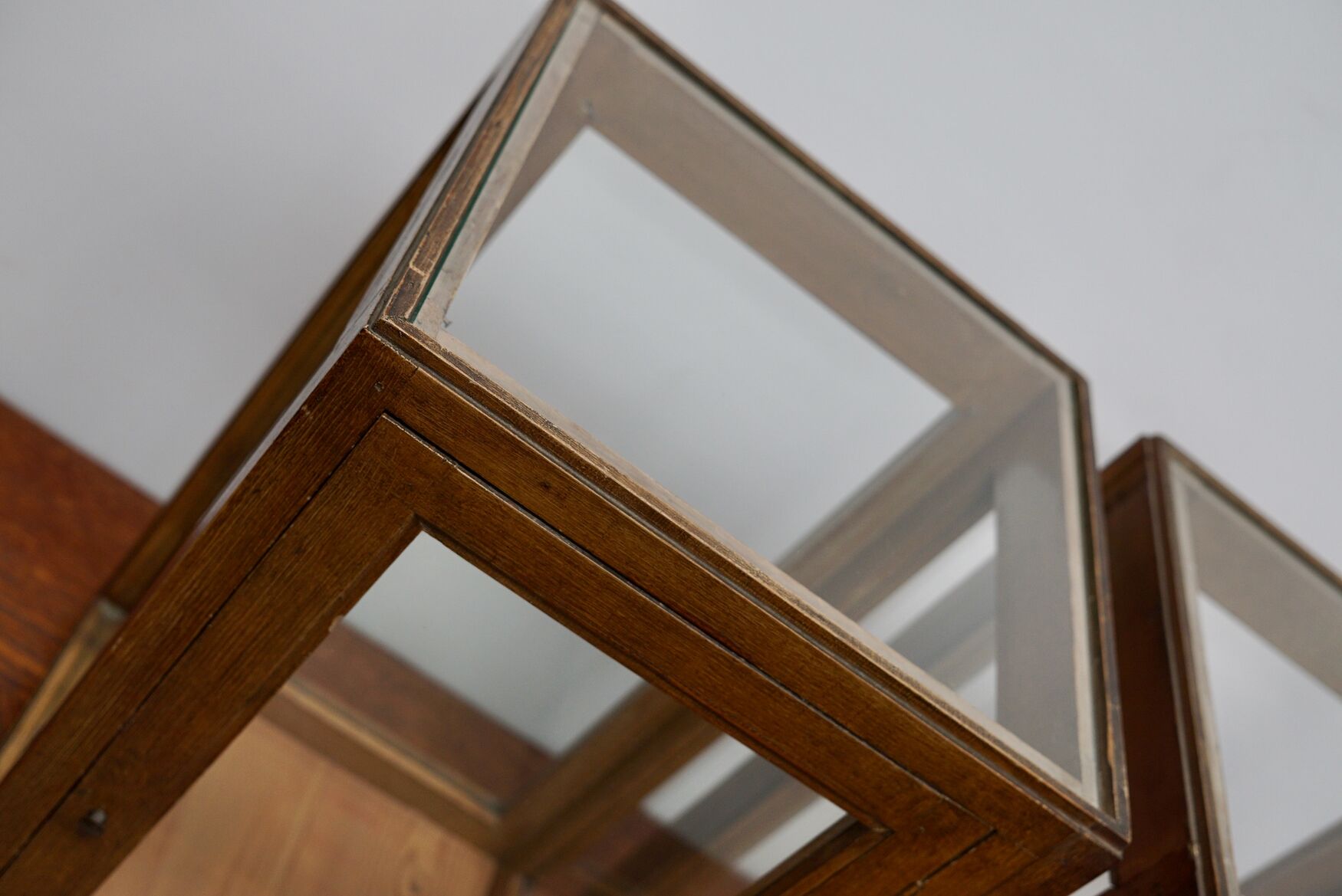 pair of faux oak shop display cabinets, circa 1920s