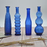 Set of 4 blue bottles of decoration