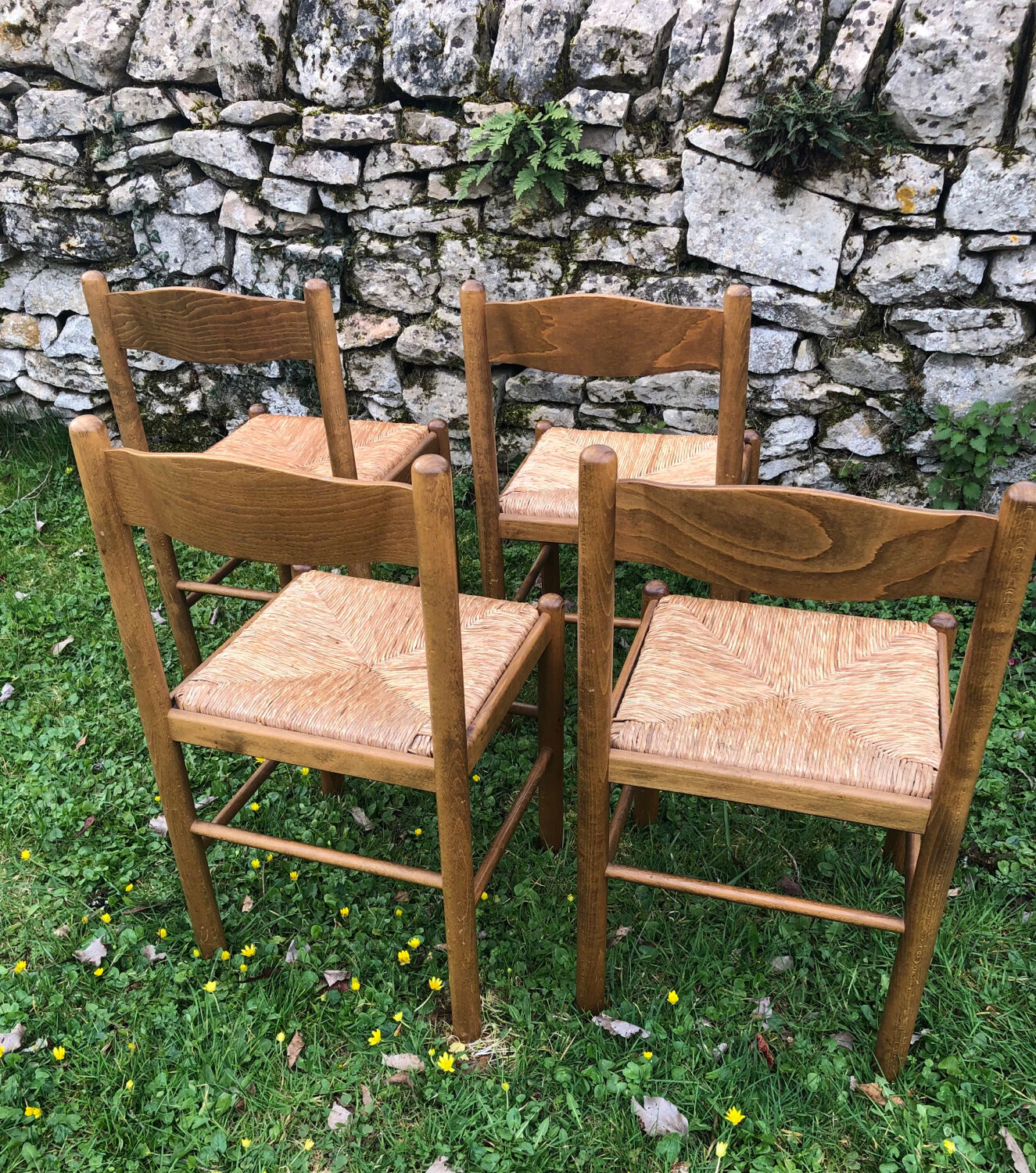 4 wood and straw chairs