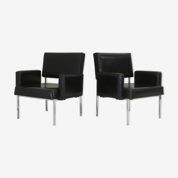Pair of stainless steel, black leather-like armchairs, France, circa 1970