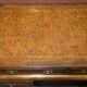 Curved pedestal desk in veined walnut, leather surface, late Victorian period.