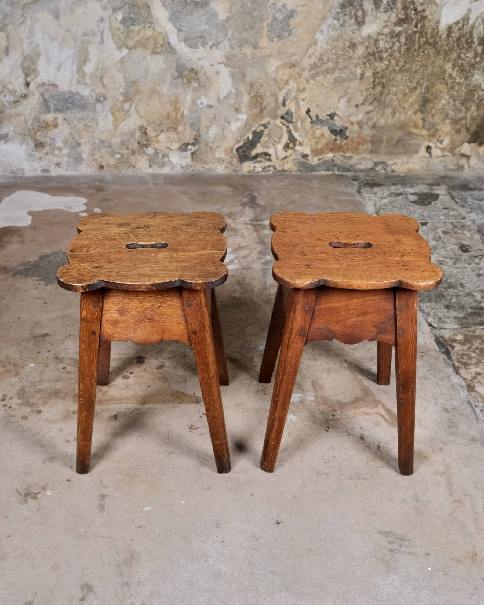 Pair of scalloped oak stools, France, early 20th century