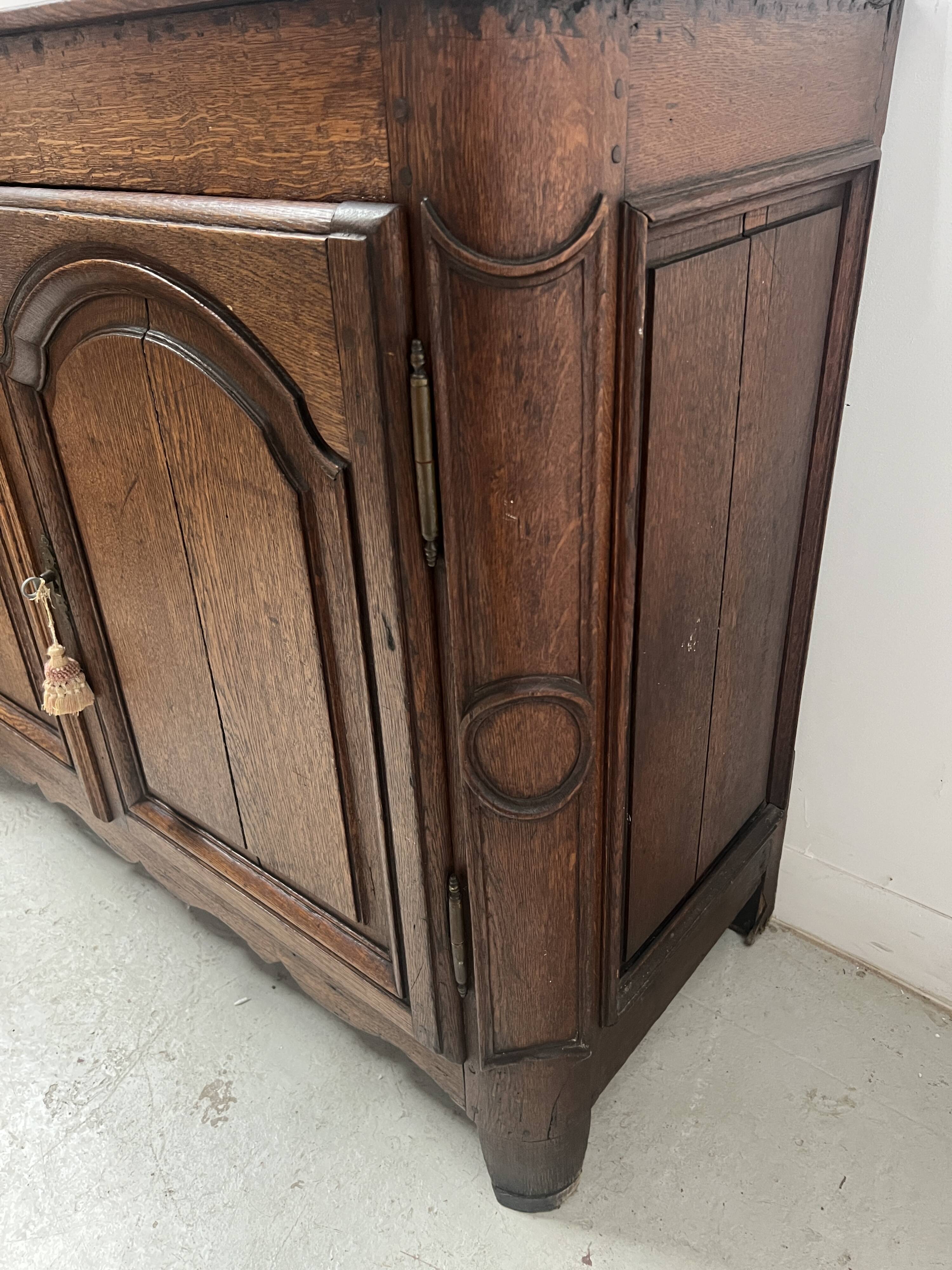 Two-door buffet in solid oak, Louis XIV style, 18th century.