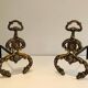 Pair of neoclassical andirons in bronze and wrought iron