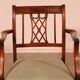 Set of 10 chairs and two mahogany armchairs in Hepplewhite style.