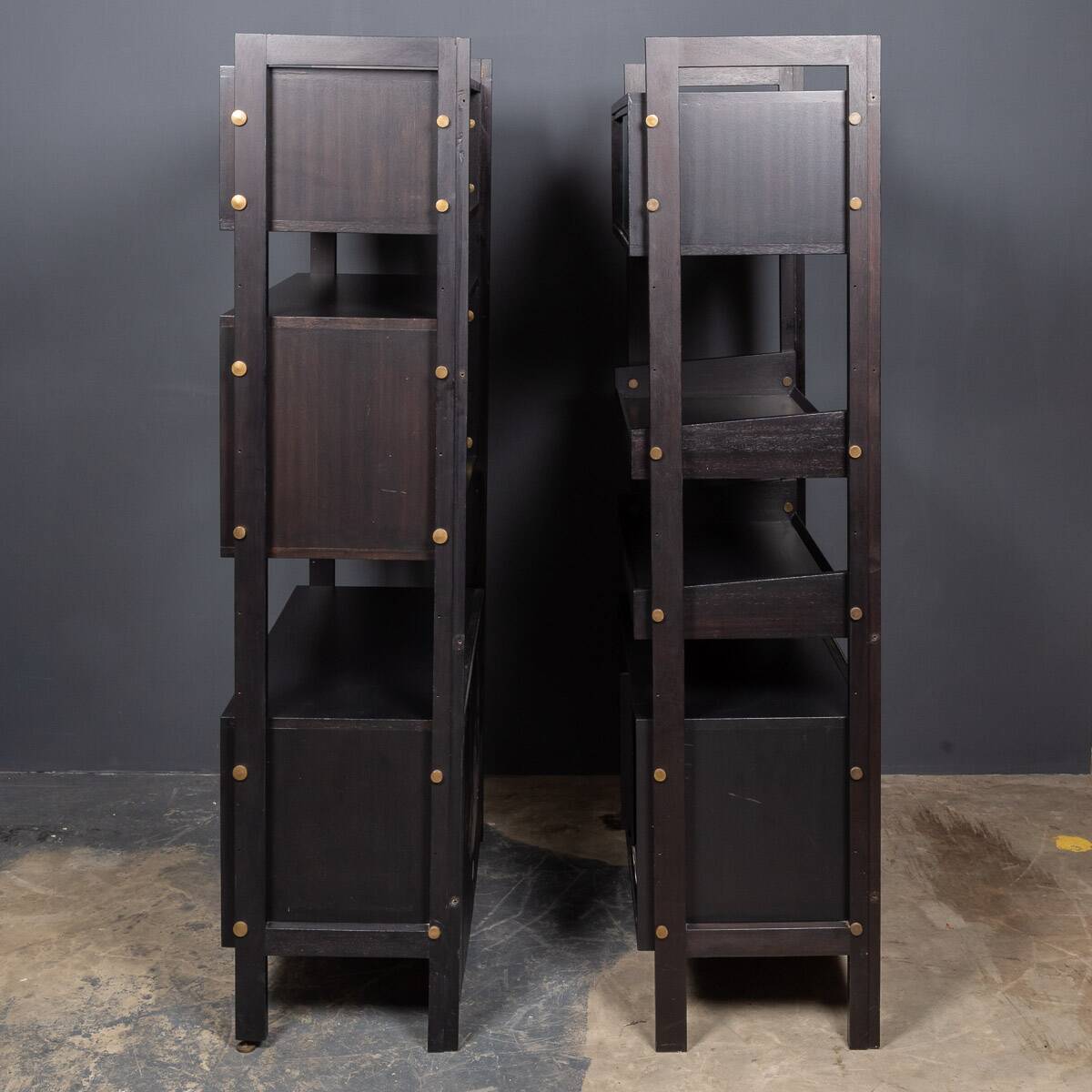Striking 20thc italian ebonised etageres with open back & storage c.1970