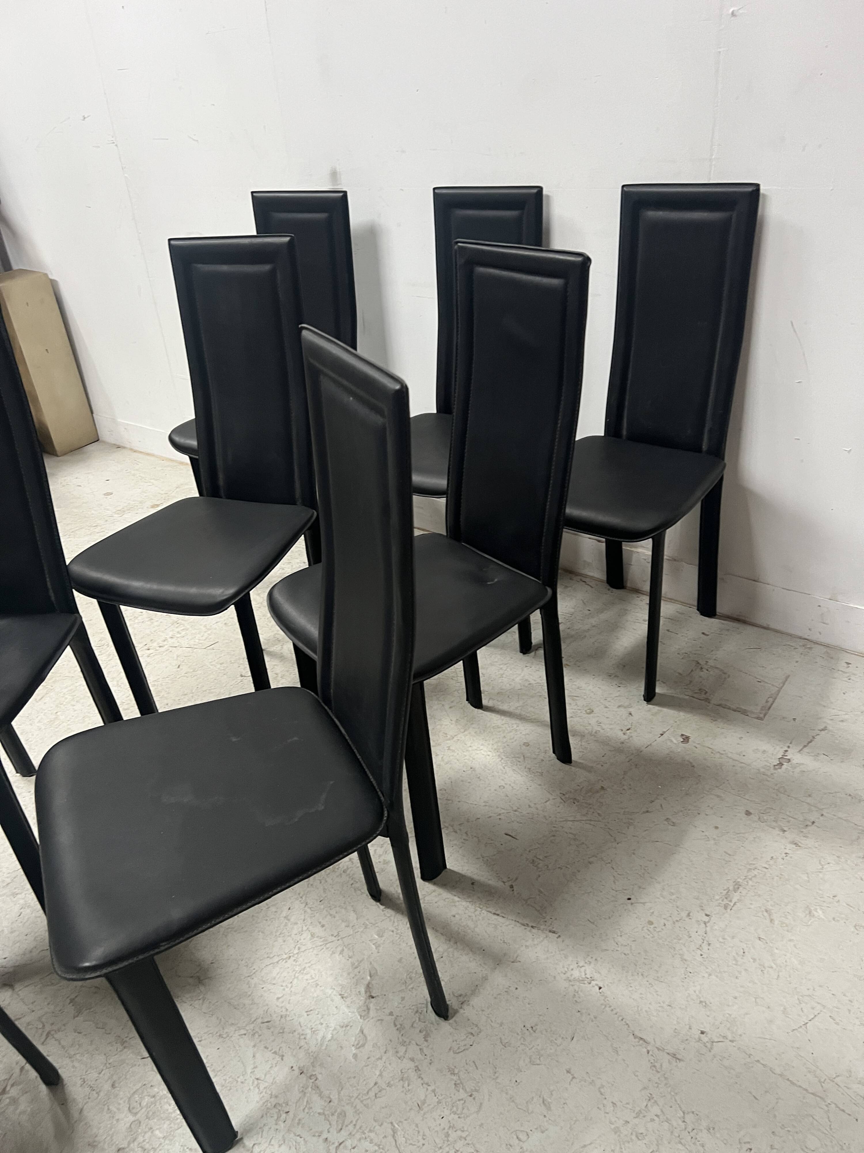 Set of eight designer chairs in black leather from the 20th century
